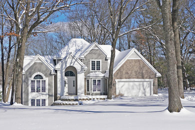 Traditional gray wood house exterior idea in Grand Rapids