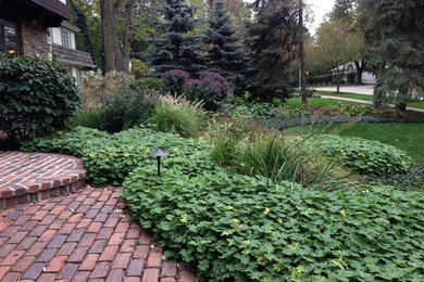 Inspiration for a small partial sun front yard concrete paver landscaping in Chicago.