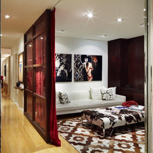 Design ideas for a contemporary open plan home cinema in New York.