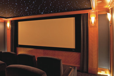 Example of a classic enclosed carpeted home theater design in San Francisco