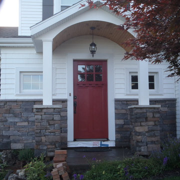 Addition with door canopy and stone work
