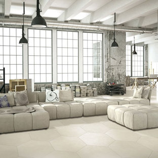 This is an example of an expansive urban open plan living room in Manchester with grey walls and ceramic flooring.