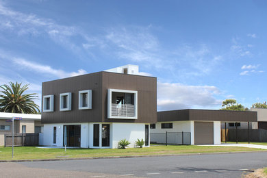 This is an example of a small modern home design in Other.
