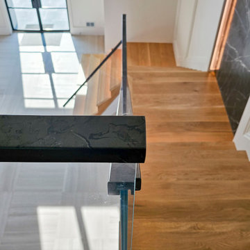 Project #107 | Freestanding Staircase with Marble Backdrop