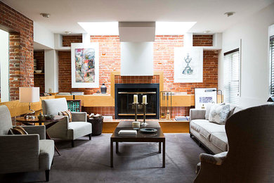 Example of an eclectic loft-style living room design in Philadelphia with white walls, a standard fireplace, a brick fireplace and no tv