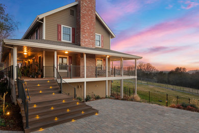 Deck - mid-sized farmhouse backyard metal railing deck idea in Sacramento with a roof extension