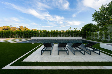 Pool landscaping - mid-sized transitional backyard stone and rectangular pool landscaping idea in Phoenix
