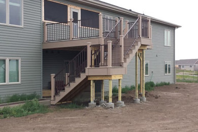 Deck - modern backyard deck idea in Other