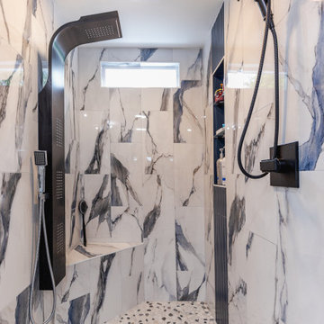 Bathroom remodeling in Columbia, MD with double vanity & marble bathtub