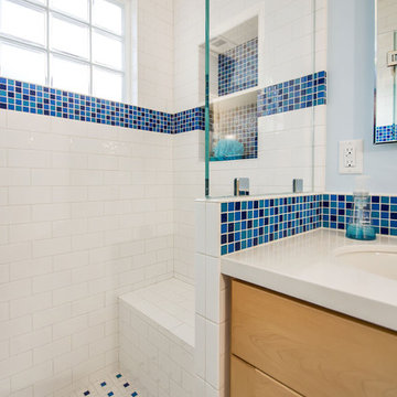 Shower Seat in cheery blue and white bathroom