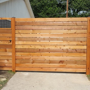 Custom Horizontal cedar fence with automatic swing gate