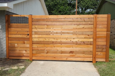 Custom Horizontal cedar fence with automatic swing gate