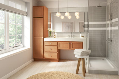 Bathroom - mid-sized transitional master gray tile and subway tile laminate floor and beige floor bathroom idea in Denver with recessed-panel cabinets, medium tone wood cabinets, white walls, an integrated sink and quartzite countertops