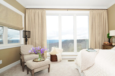 Large transitional master carpeted and beige floor bedroom photo in Other with beige walls