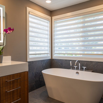 Serene Bathroom with Freestanding Tub & Layered Lighting