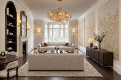 Large contemporary living room in London with dark hardwood flooring, brown floors, wallpapered walls and feature lighting.