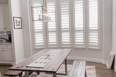 Inspiration for a cottage wood wall dining room remodel in Dallas