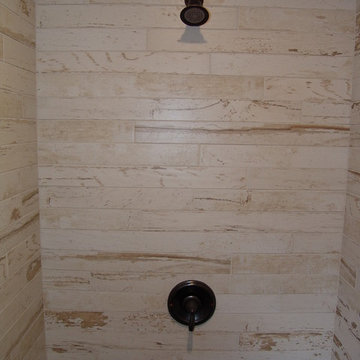 ShipLap Walls Shower Wall Pebble Shower Floor  Koch Cabinets Rustic Beech