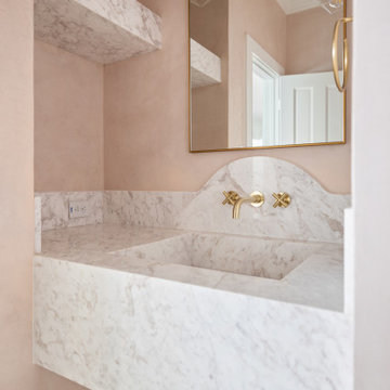 Elegant Powder Room with Integrated Stone Sink | Houston