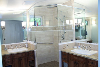 Inspiration for a mid-sized transitional master beige tile and porcelain tile travertine floor and beige floor bathroom remodel in Other with furniture-like cabinets, dark wood cabinets, blue walls, a drop-in sink and granite countertops