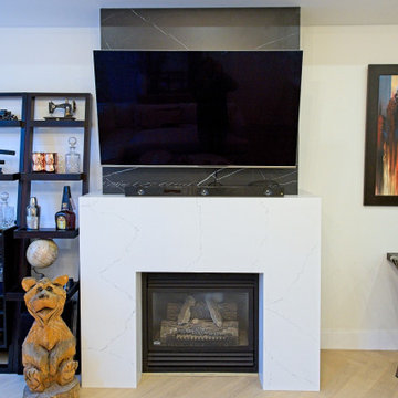 White Fireplace Surround with Dark Television Feature Panel | Downtown Toronto