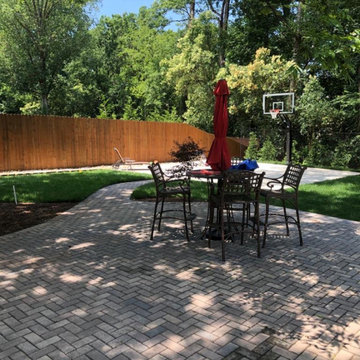 Screen porch, basketball court, and landscaping