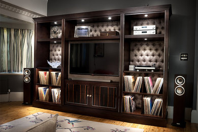 Photo of an expansive contemporary formal enclosed living room in Surrey with grey walls, light hardwood flooring and a built-in media unit.