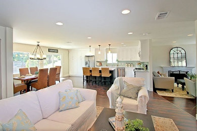 Mid-sized beach style open concept laminate floor living room photo in Los Angeles with a standard fireplace and a stone fireplace