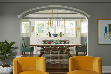 Example of a large eclectic dark wood floor and brown floor enclosed dining room design in Minneapolis with gray walls and no fireplace