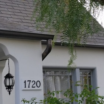 Bonderized Steel, 5 inch Half Round Seamless Gutters with Round Downspouts.