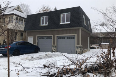 Example of a large classic detached two-car garage workshop design in Other