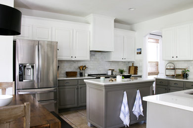 Example of a mid-sized transitional u-shaped open concept kitchen design in Austin with raised-panel cabinets, white cabinets, white backsplash, marble backsplash and an island