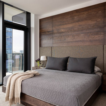 Proper Terrace Penthouse Primary Bedroom with Wire-Brushed White Oak