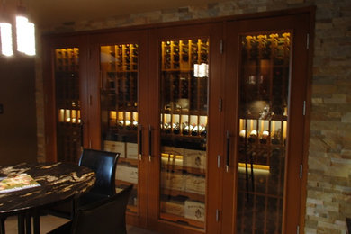 Wine cellar - contemporary wine cellar idea in Calgary