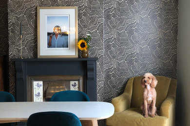 Design ideas for a medium sized contemporary kitchen/dining room in London with green walls, light hardwood flooring and wallpapered walls.