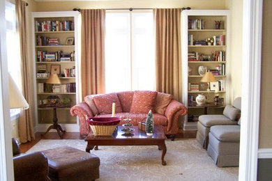 Living room - traditional formal and enclosed medium tone wood floor living room idea in New York with beige walls and no tv