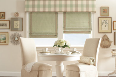 Mid-sized elegant beige floor kitchen/dining room combo photo in Other with white walls