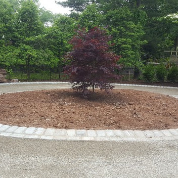 Belgian block curbing with Pea Gravel driveway.