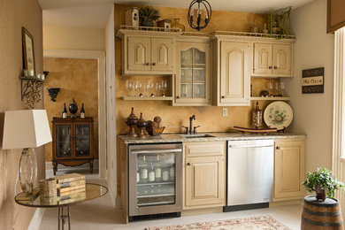 Inspiration for a small rustic single-wall home bar remodel in Philadelphia with an undermount sink, raised-panel cabinets and light wood cabinets
