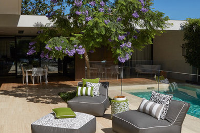 Design ideas for a beach style backyard patio in Melbourne.