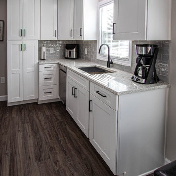 White and Gray Compact Kitchen with LVT Flooring