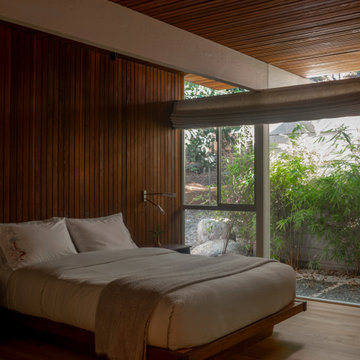 Hollywood Hills Bedroom with Floor-to-Ceiling Windows and Garden Views
