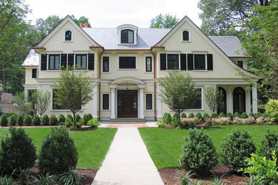Large traditional three-storey white exterior in New York with a gable roof.