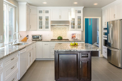 Kitchen - transitional kitchen idea in San Francisco with an undermount sink, beaded inset cabinets, white cabinets, white backsplash, subway tile backsplash, stainless steel appliances and an island