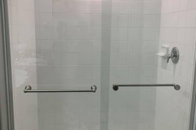 Sliding shower door - contemporary sliding shower door idea in Tampa