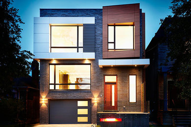 Mid-sized modern brown two-story brick exterior home idea in Toronto