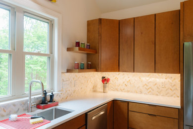 Kitchen - mid-sized contemporary kitchen idea in Other with a drop-in sink, flat-panel cabinets, medium tone wood cabinets, quartzite countertops, beige backsplash, a peninsula and white countertops