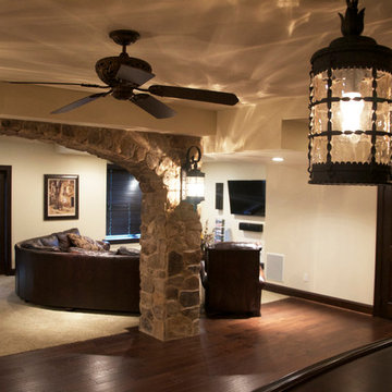 Basement with Curved Bar and Entertainment Areas