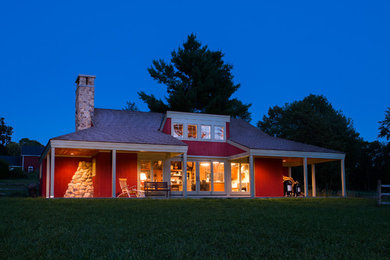 Inspiration for a small timeless red two-story wood house exterior remodel in Bridgeport with a hip roof and a shingle roof