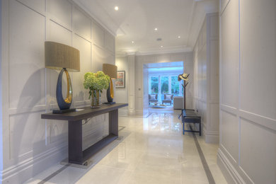 Inspiration for a large contemporary hallway in London with grey walls and porcelain floors.
